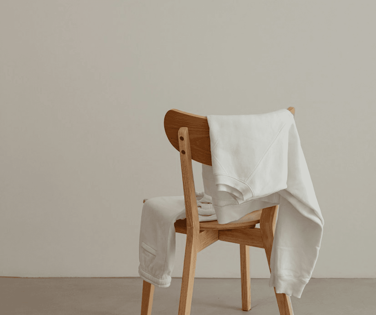 A chair with clothes ready for a new purpose